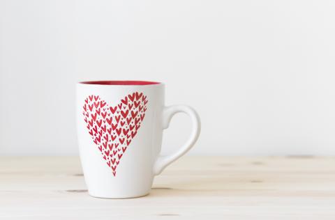 A mug with small hearts on it